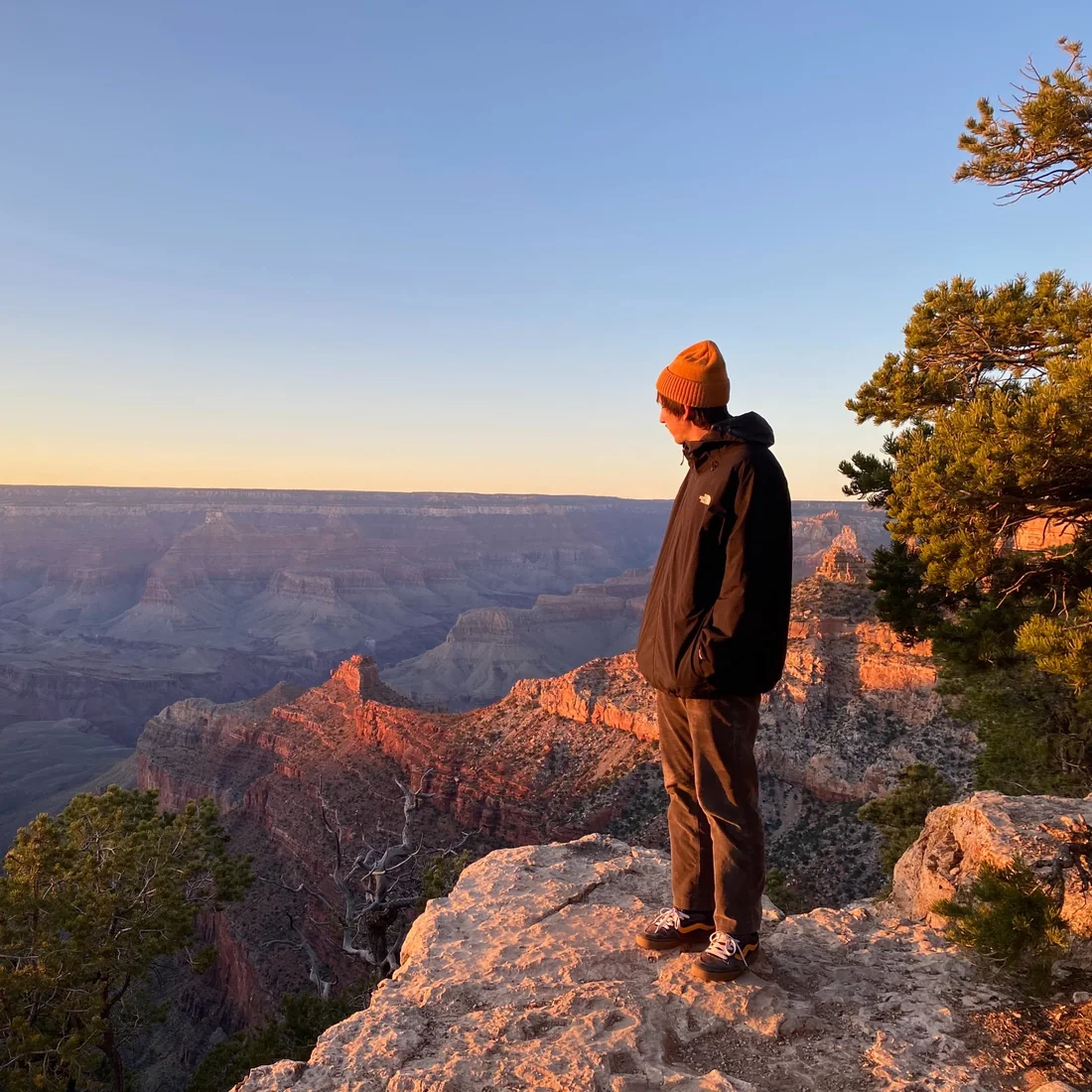 Julian looking over the Grand Canyon at sunset