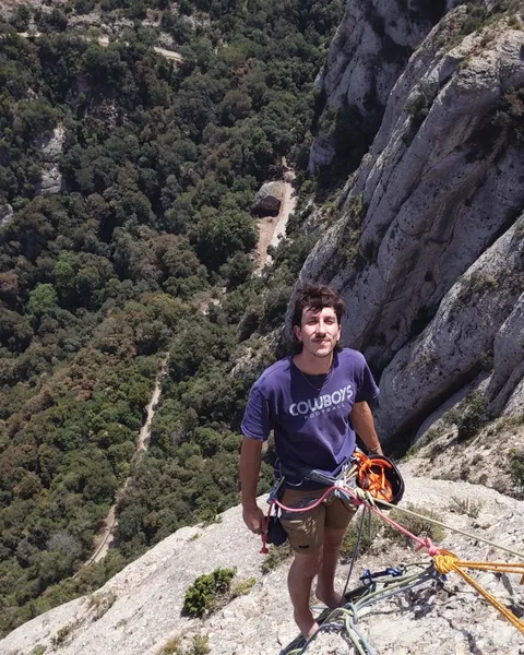 At a belay ledge while climbing